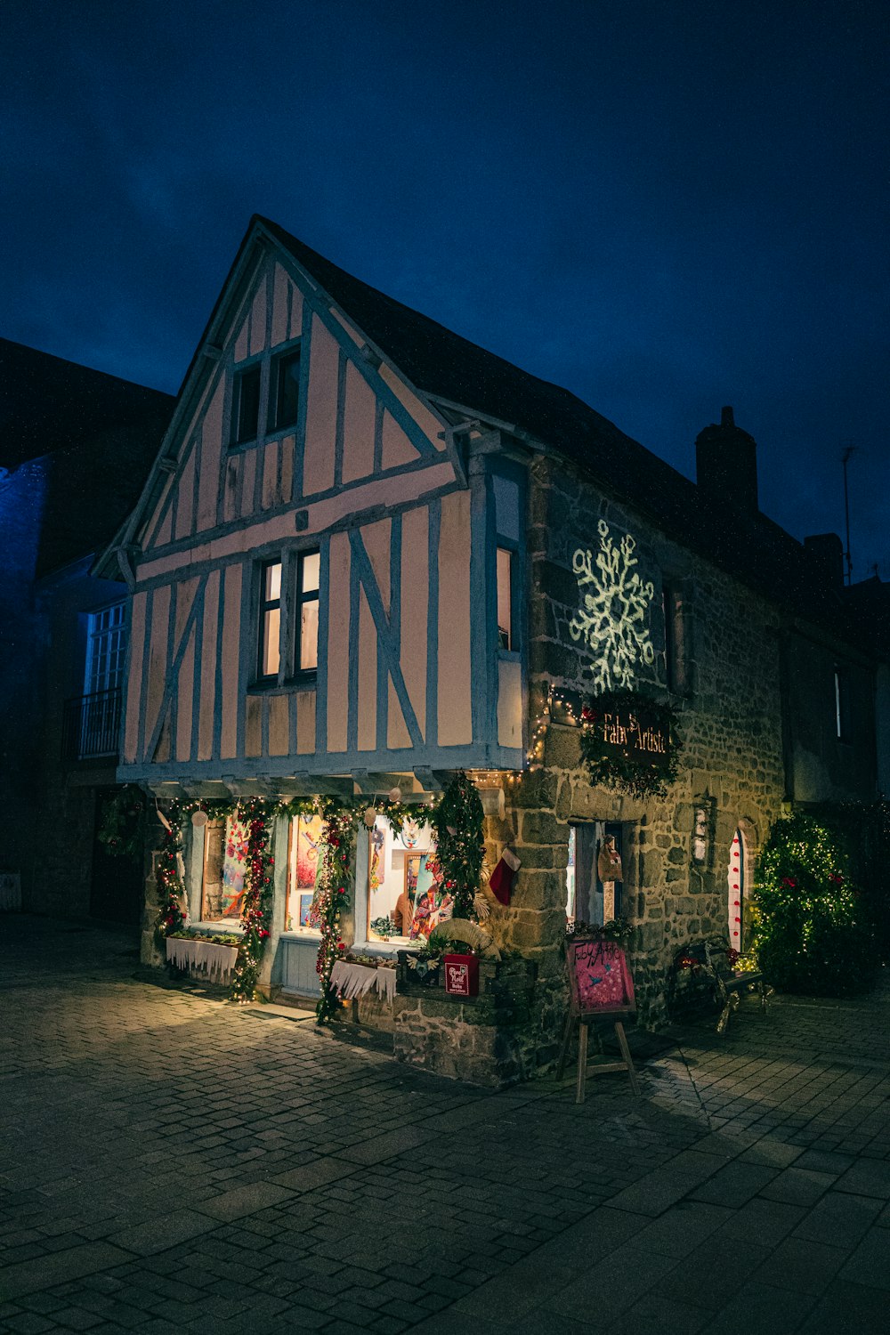 a building with a christmas decoration on the front of it