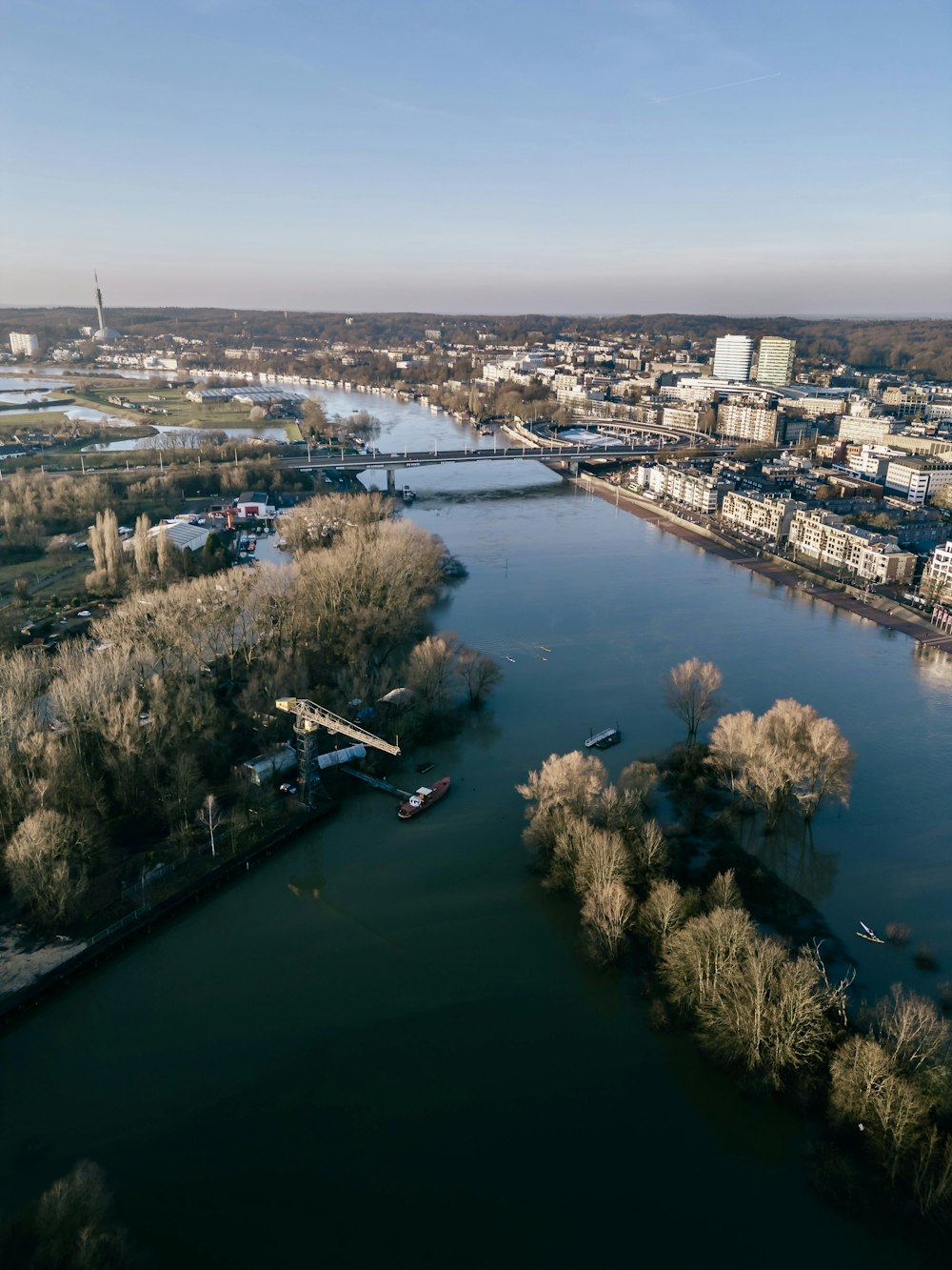 an aerial view of a river and a city