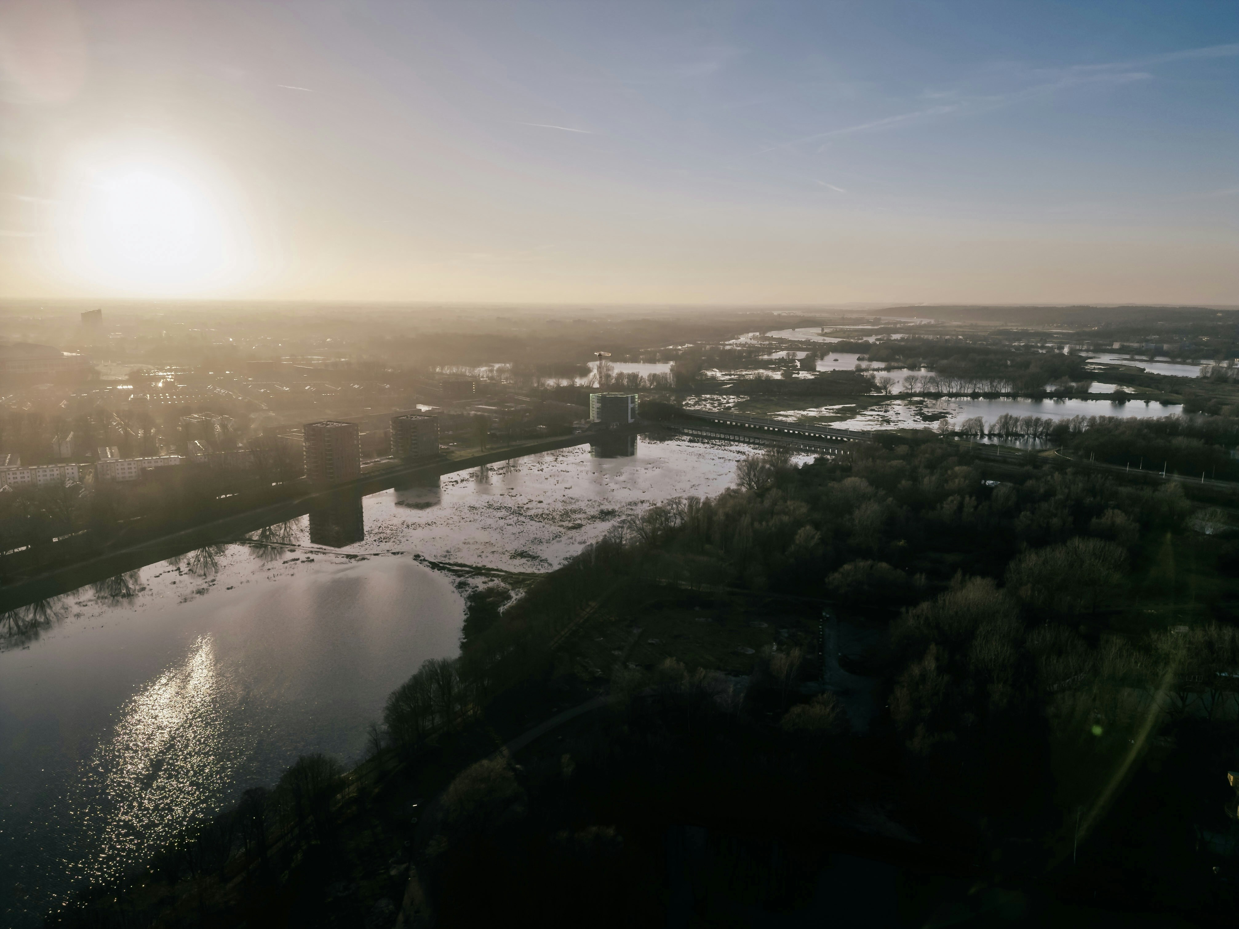 an aerial view of a river and a city