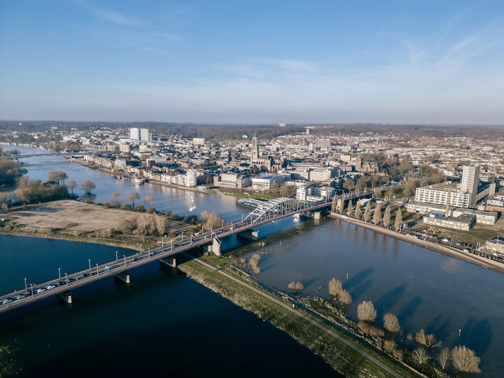 an aerial view of a river and a bridge