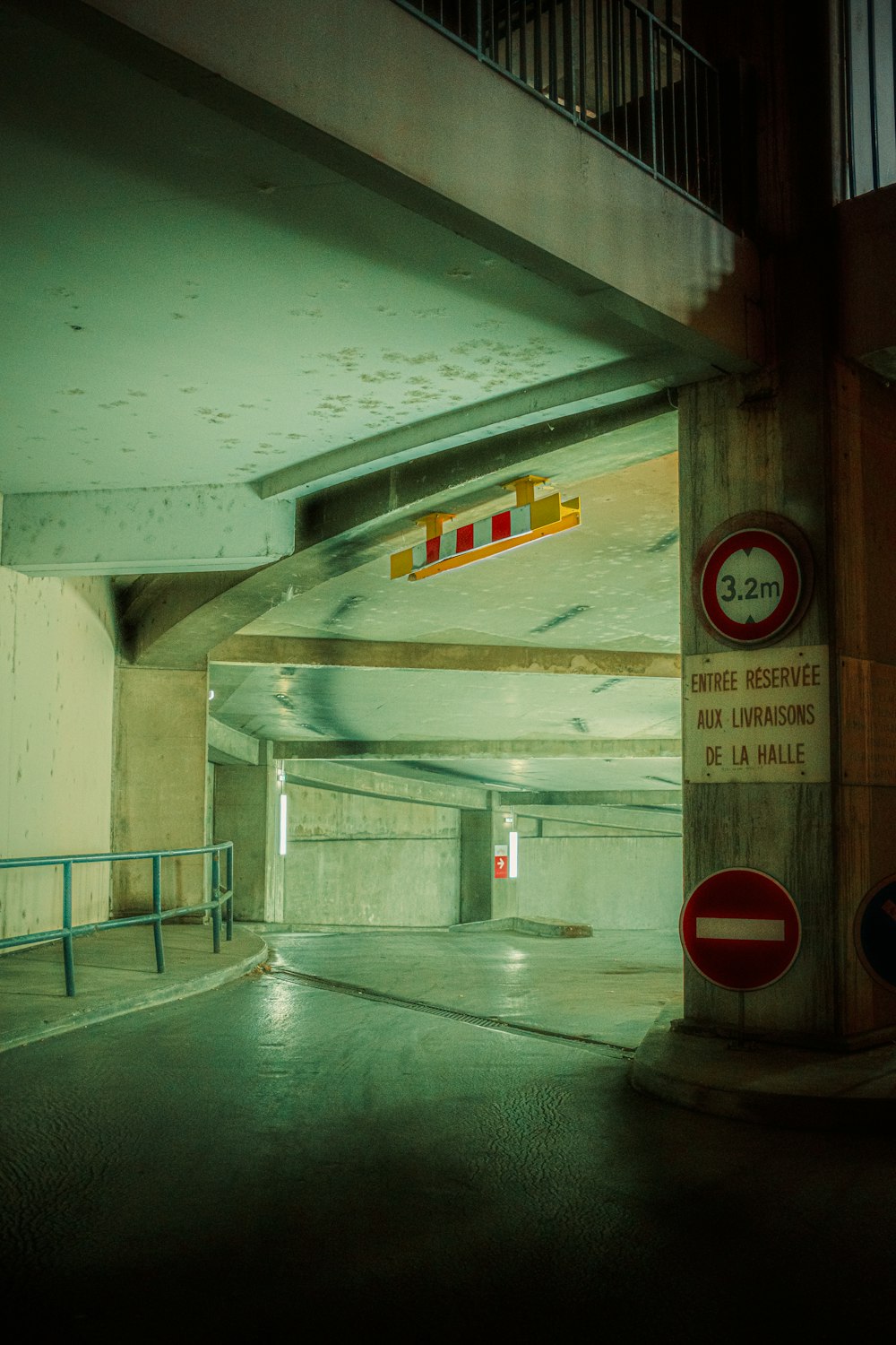 a tunnel with a few signs on it