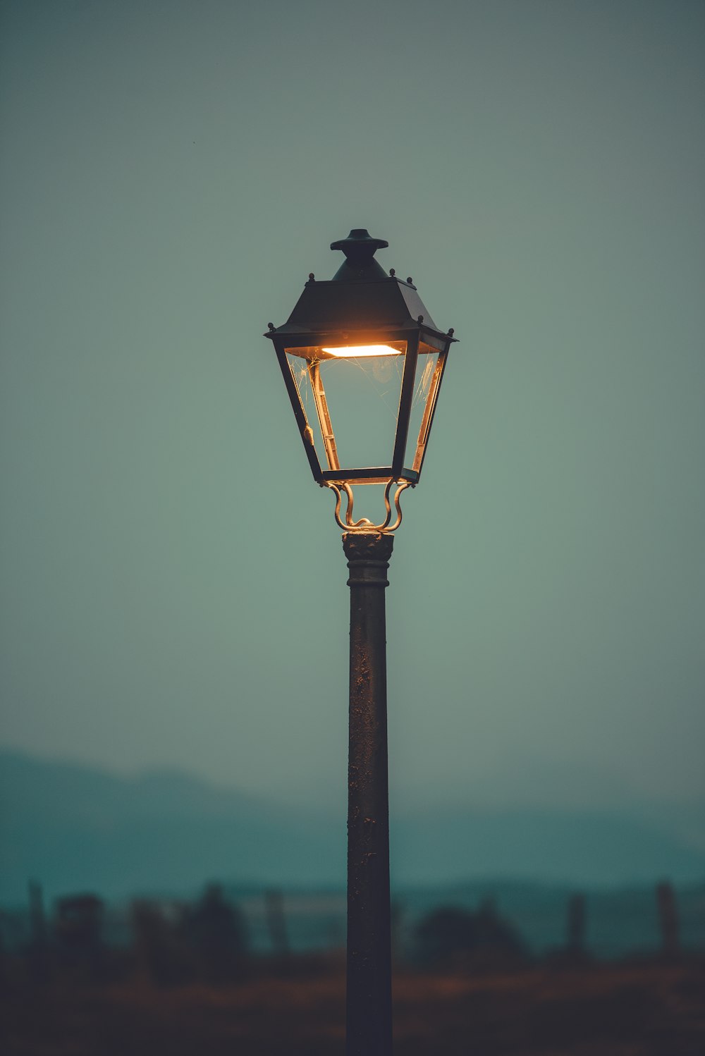 a lamp post with a light on top of it