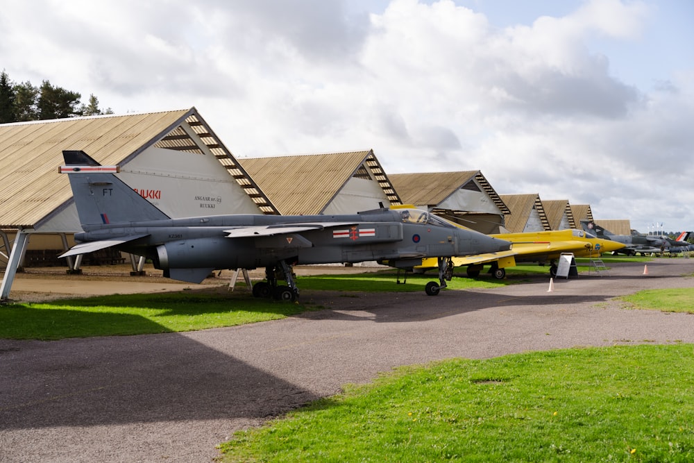 a row of fighter jets parked next to each other