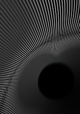 A pattern of converging lines creates an illusion of a tunnel or vortex effect, with the lines drawing the viewer's eye towards a central black void. The smooth gradient of the lines adds depth and a sense of motion.
