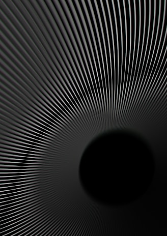 A pattern of converging lines creates an illusion of a tunnel or vortex effect, with the lines drawing the viewer's eye towards a central black void. The smooth gradient of the lines adds depth and a sense of motion.