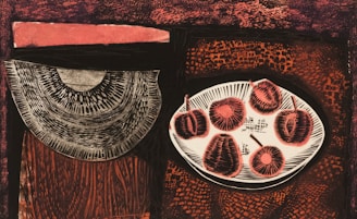 A surrealist still life with a platter holding several abstract fruit-like objects on the right, and a large, semi-circular patterned element on the left. The background features a mixture of textured patterns and a dark, earthy color palette with shades of red and orange.