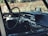 the interior of a car with a steering wheel and dashboard