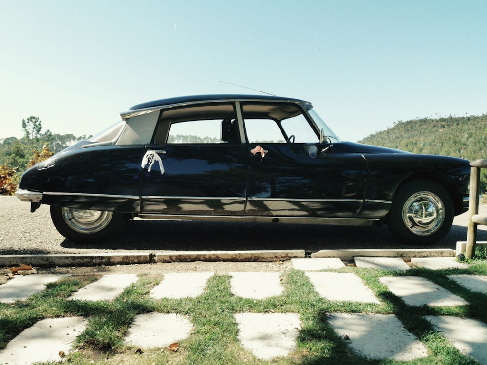 a black car parked on the side of the road