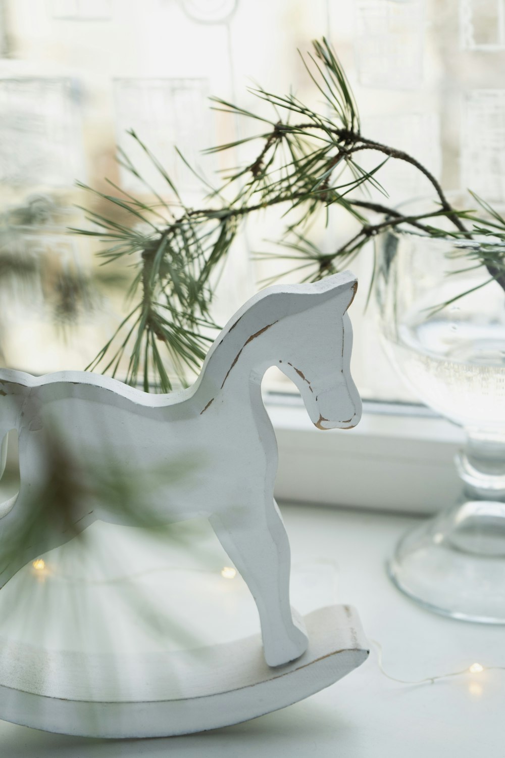 a white horse figurine sitting on top of a table