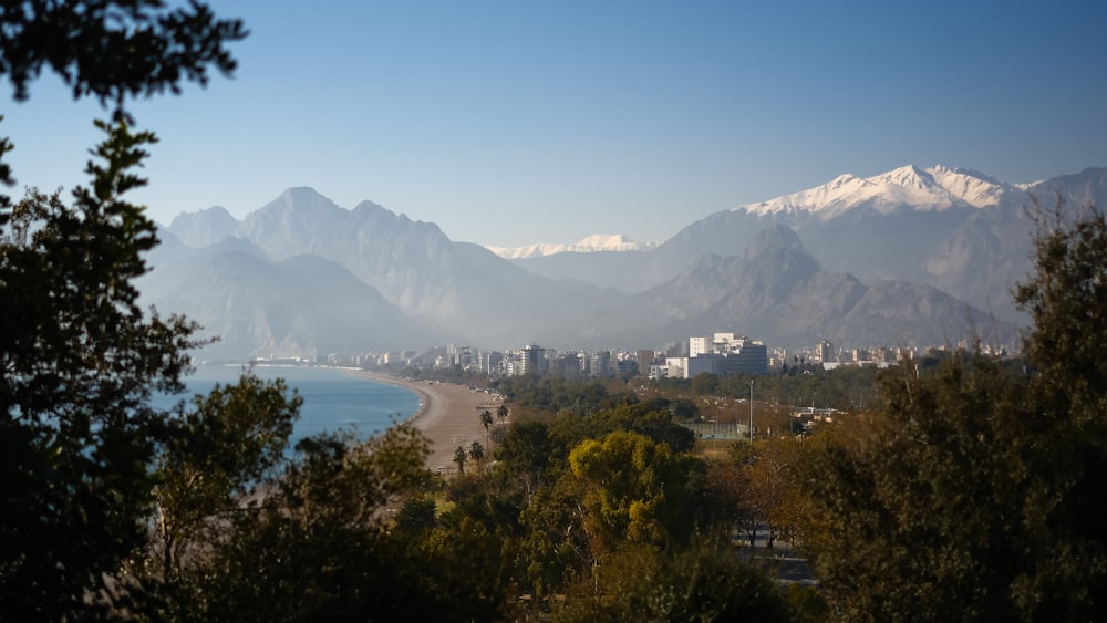 a view of a city with mountains in the background