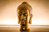 A meditative Buddha sculpture with glowing meridians.