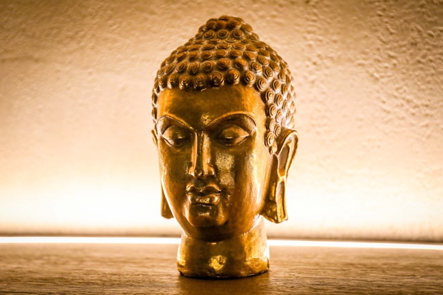 A meditative Buddha sculpture with glowing meridians.