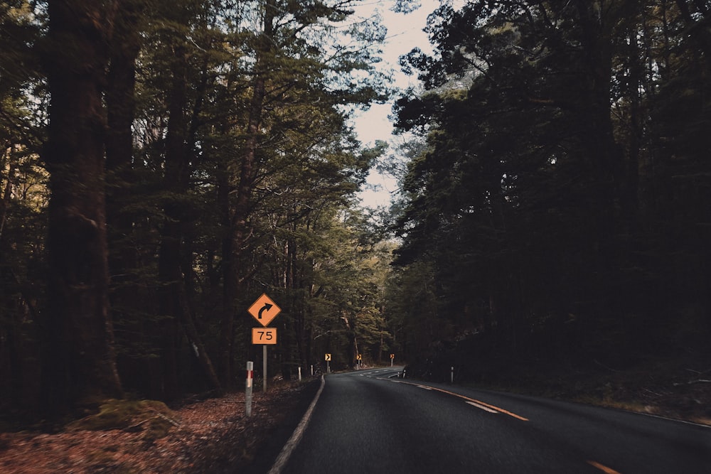 a road with a sign on the side of it