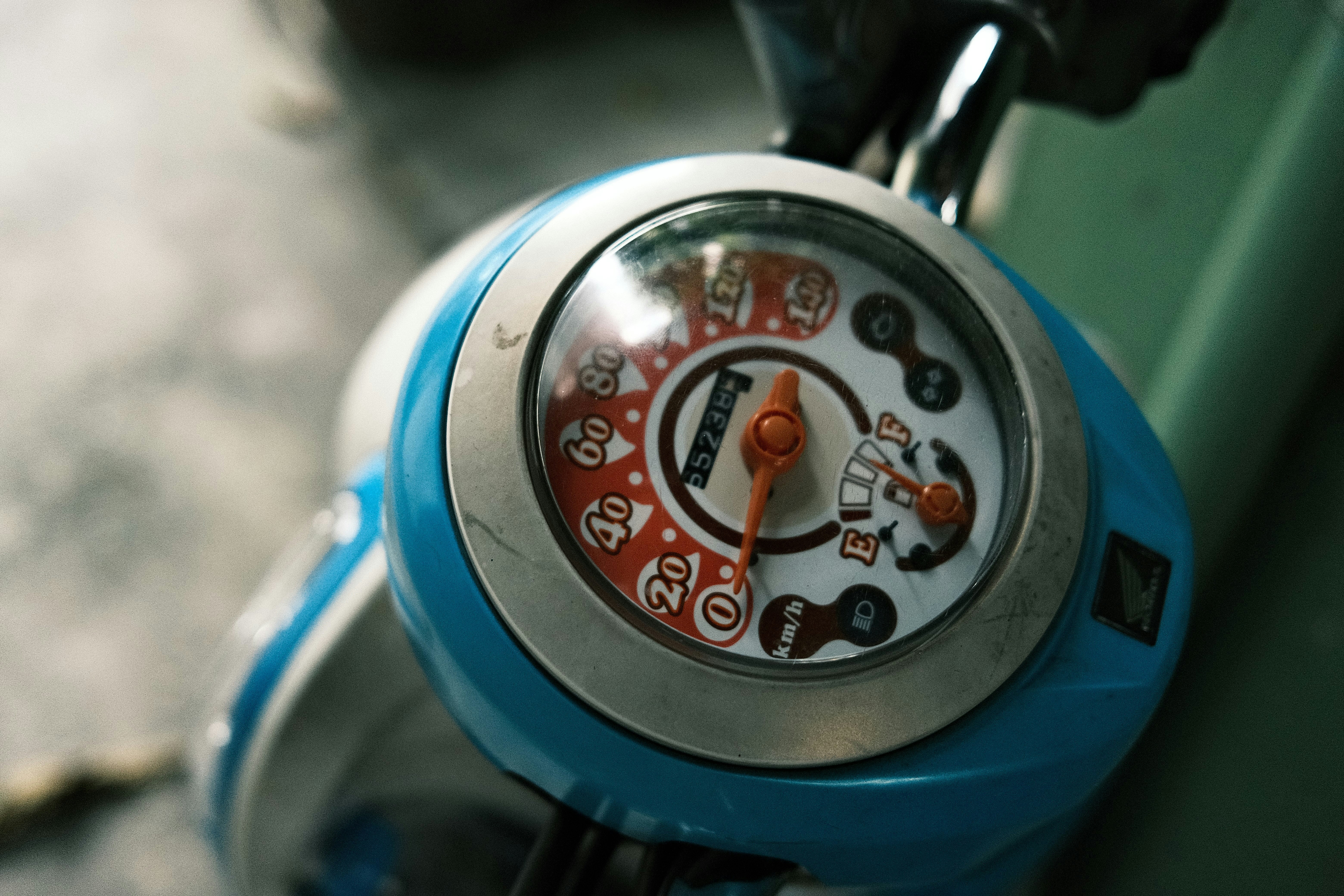a close up of a clock on a bike