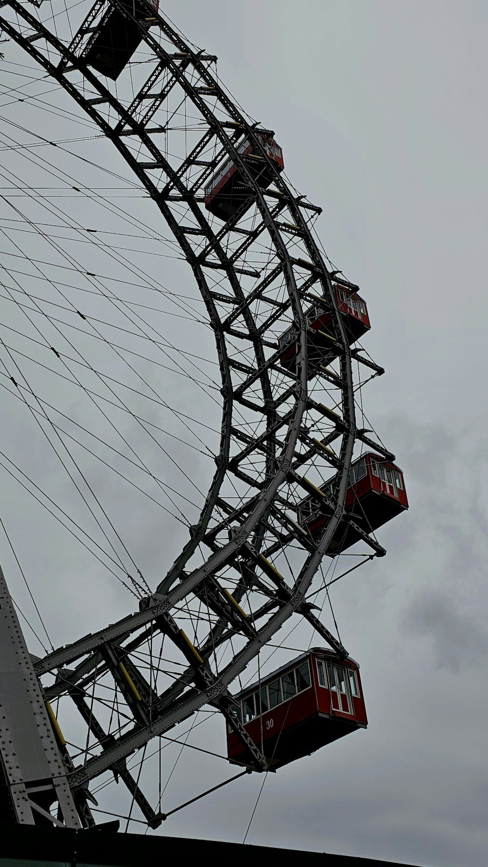 a large ferris wheel on a cloudy day