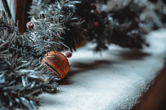 Close-up of delicate miniature ornaments arranged on a rustic wooden table.