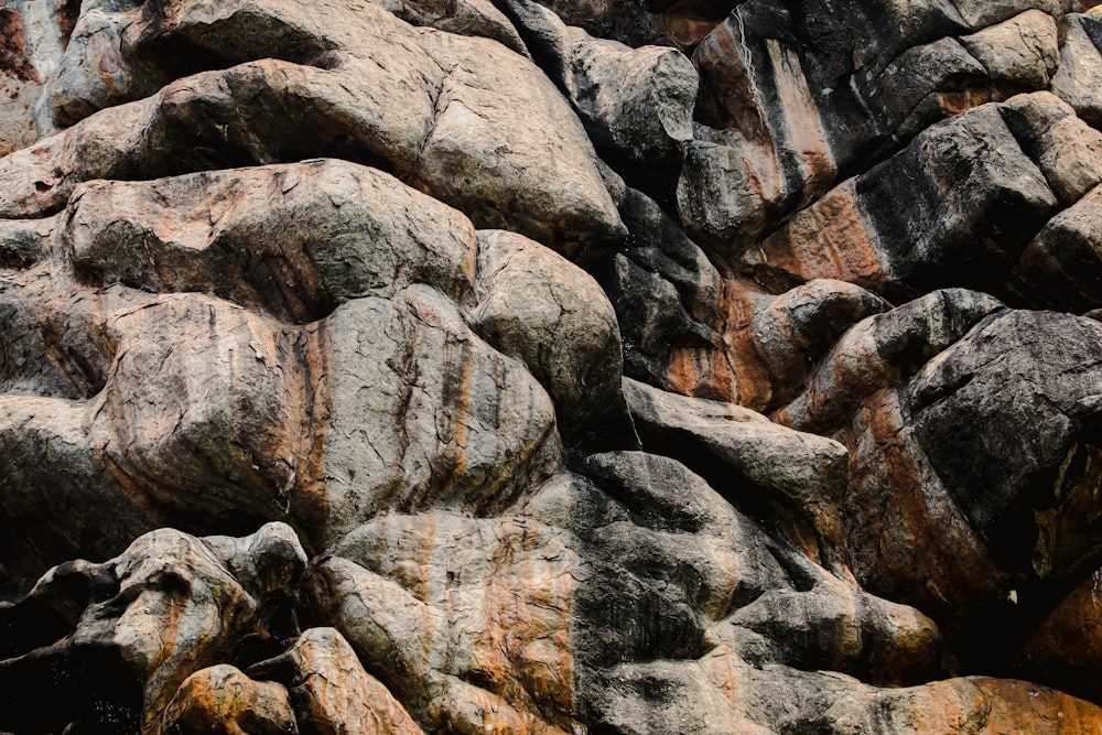 a close up of some rocks with a sky background