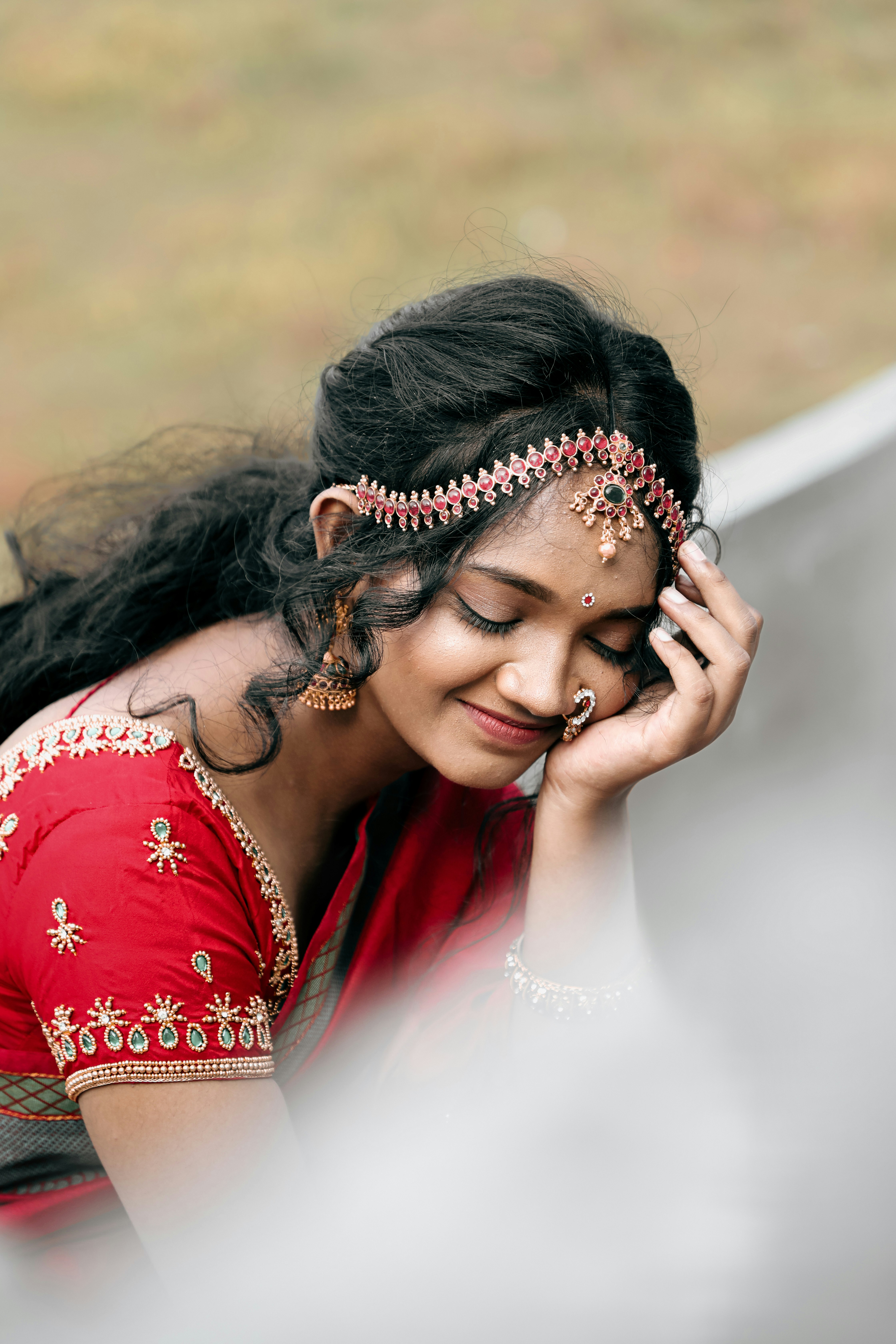 Unmarried South Indian woman in traditional saree smiling confidently