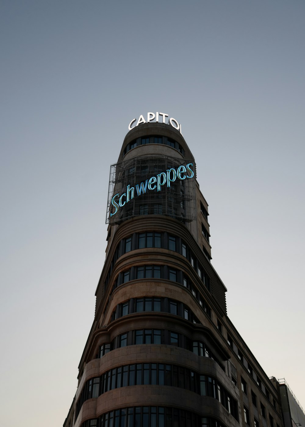 a tall building with a sign on top of it