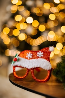 Close-up of colorful contact lenses arranged in a festive pattern with Christmas decorations.