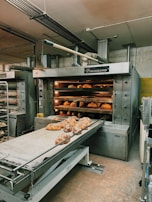 Wide shot of a production line with baking ovens and conveyors.