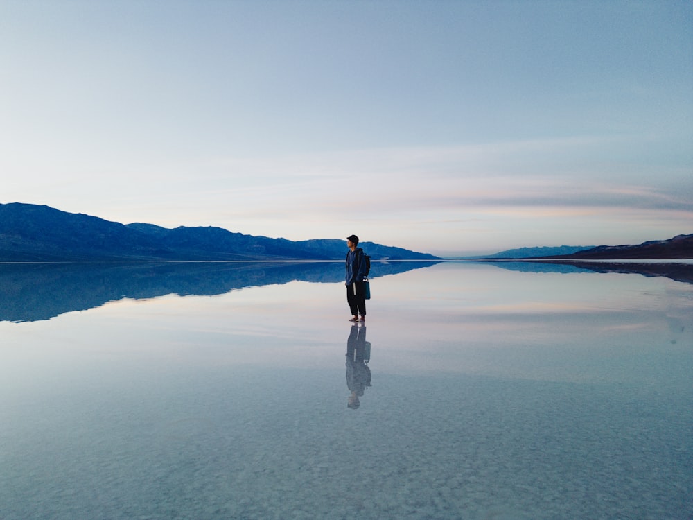 a person standing on a large body of water