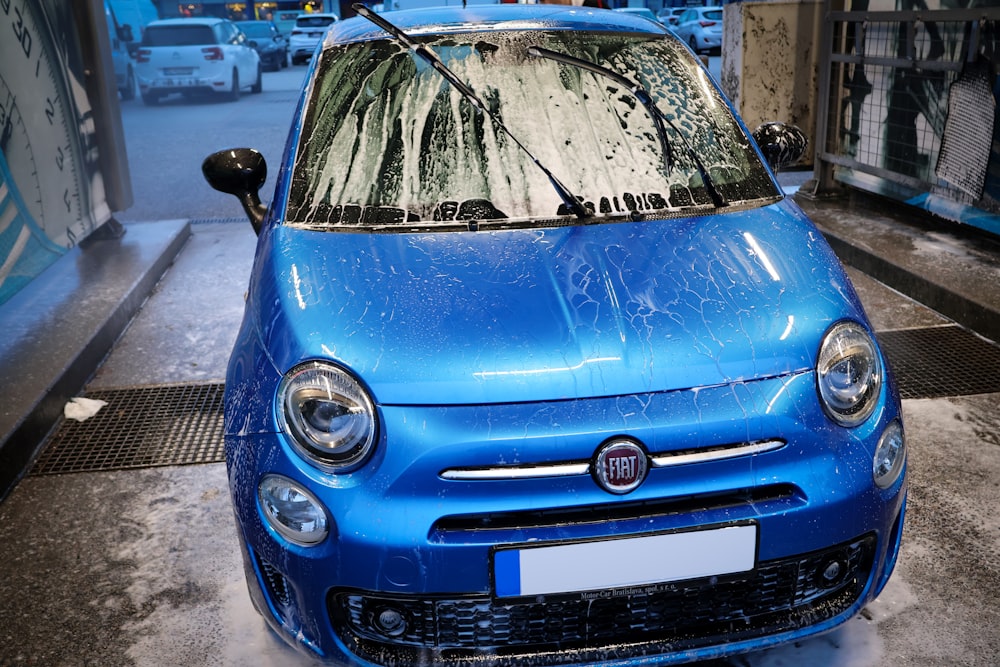 a blue car is parked in a garage