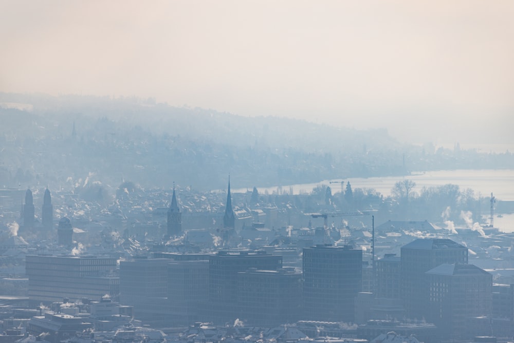 a view of a city in the fog