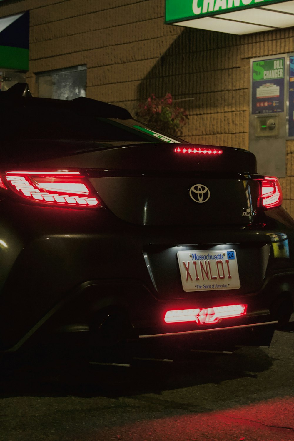 a black car parked in front of a building