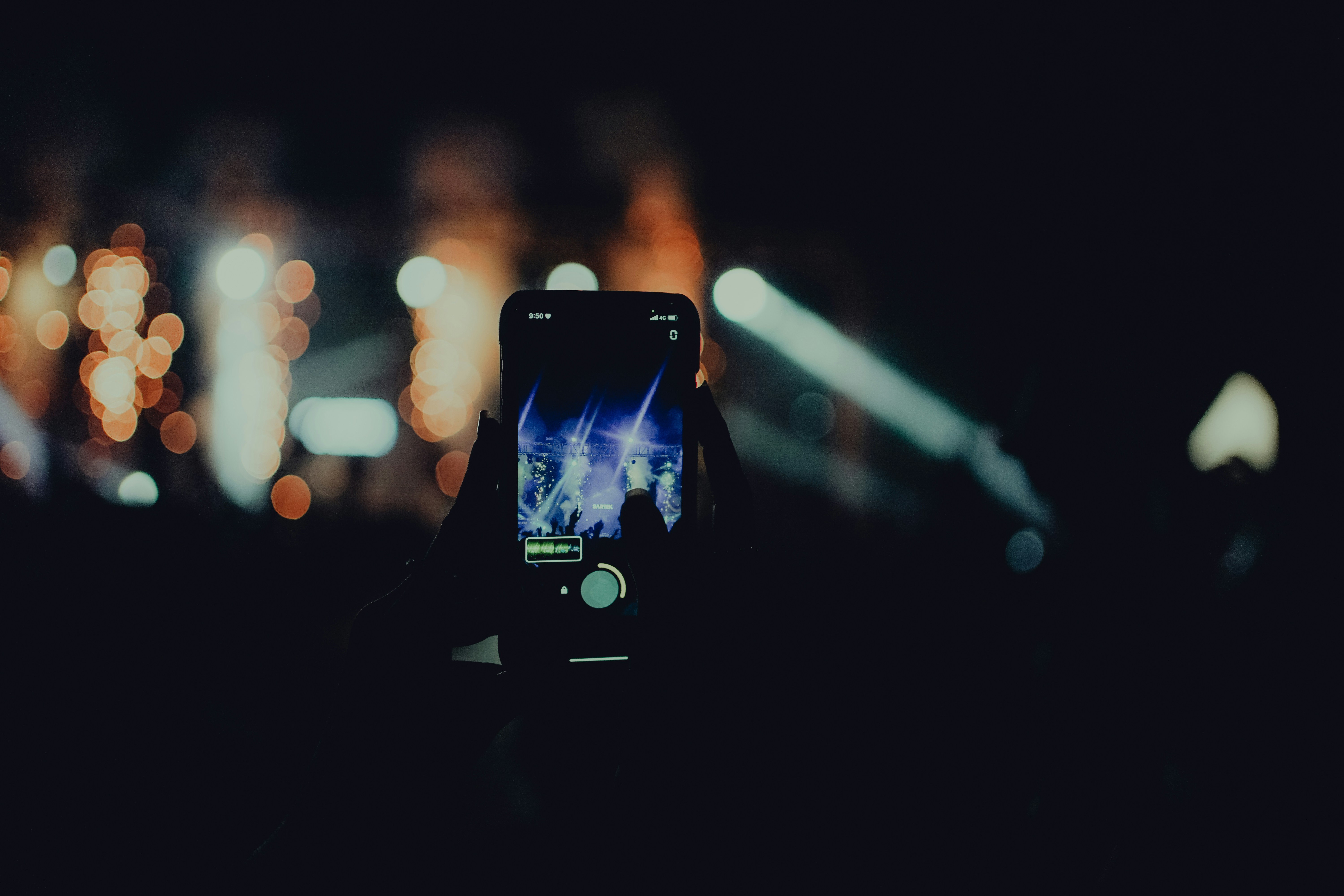 a person taking a picture with their cell phone