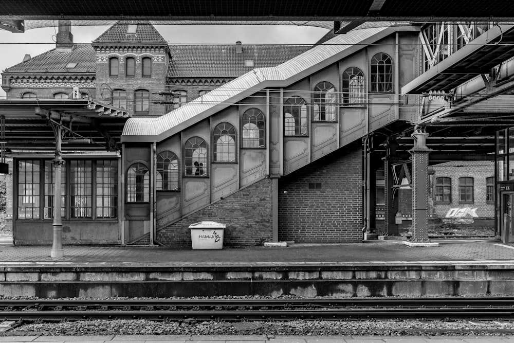 a black and white photo of a train station