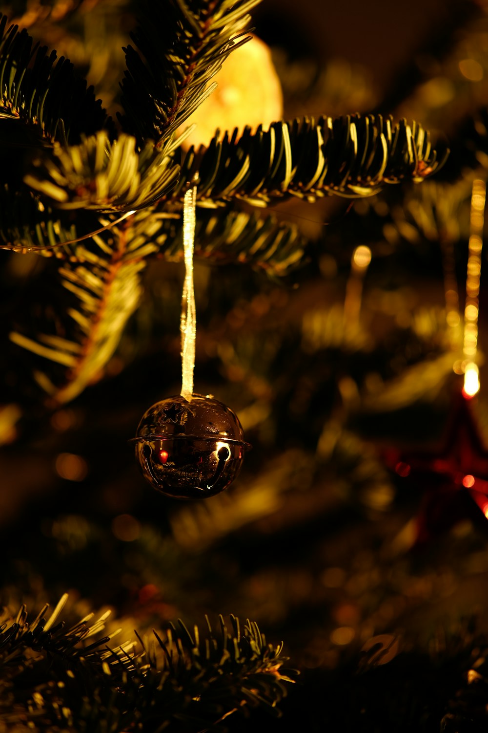 a close up of a christmas tree with ornaments