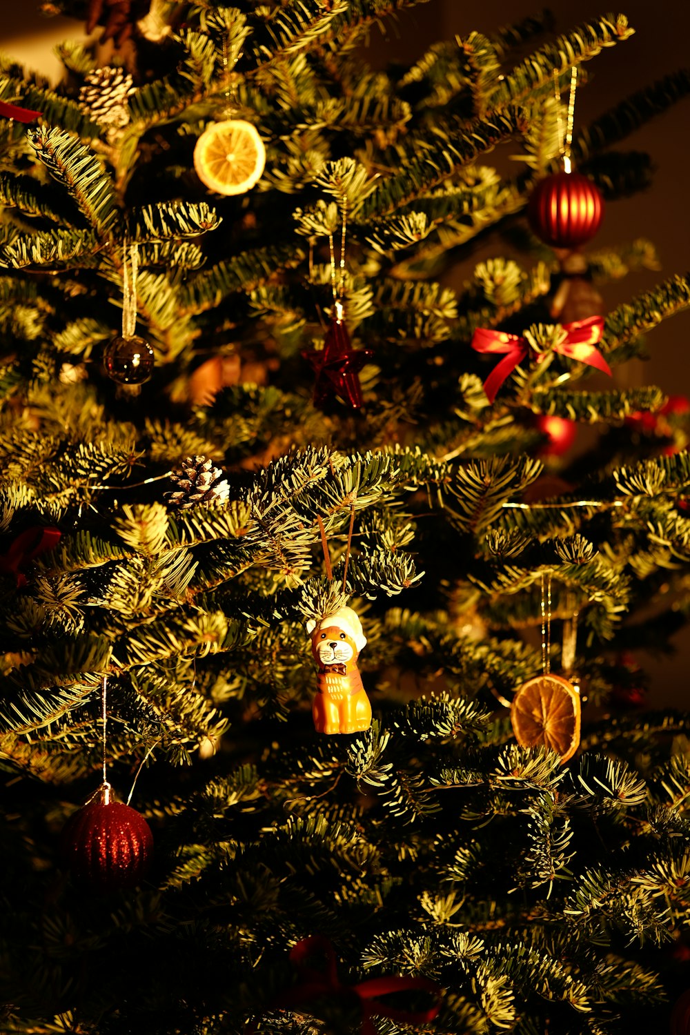 a close up of a christmas tree with ornaments