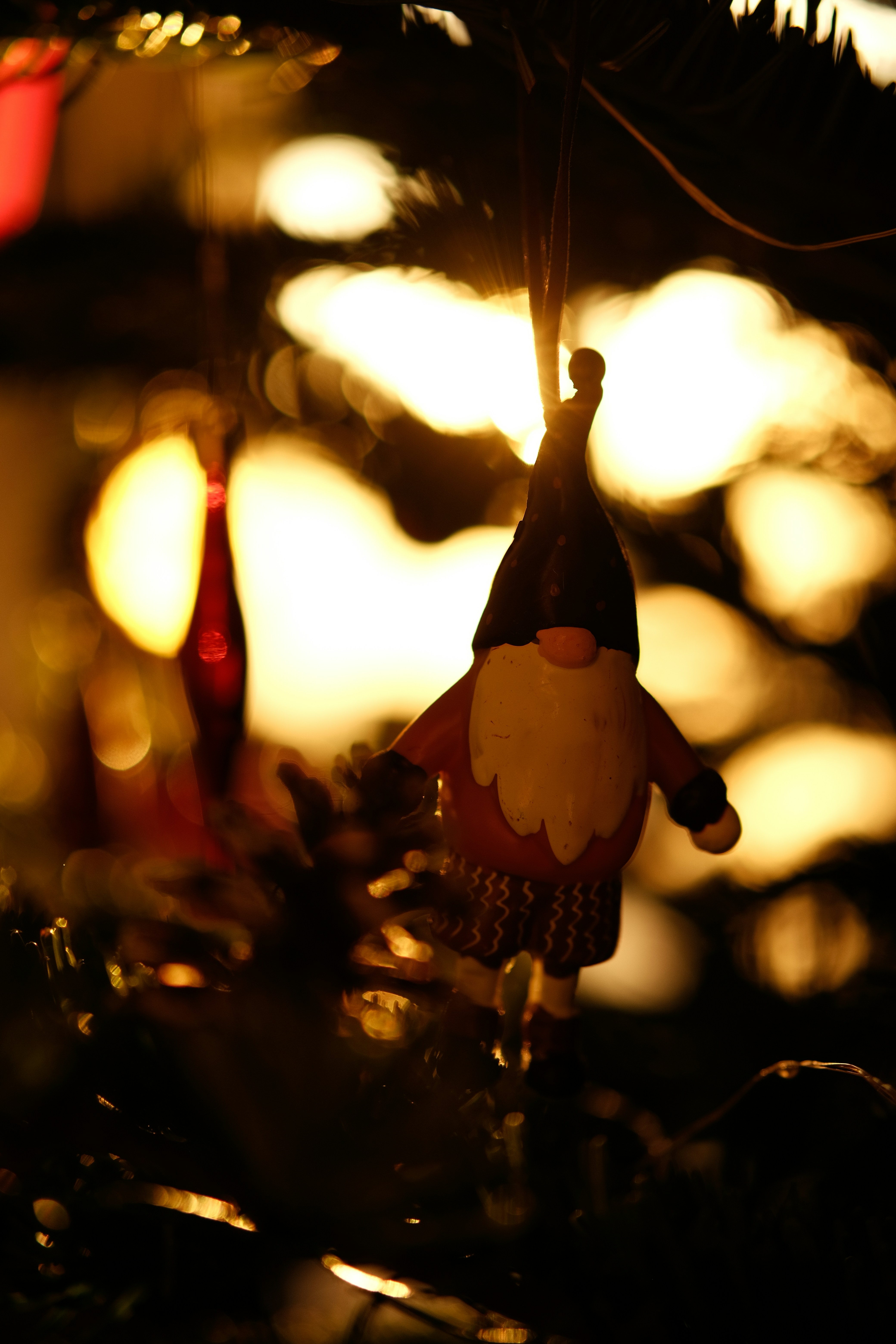 a christmas ornament hanging from a christmas tree
