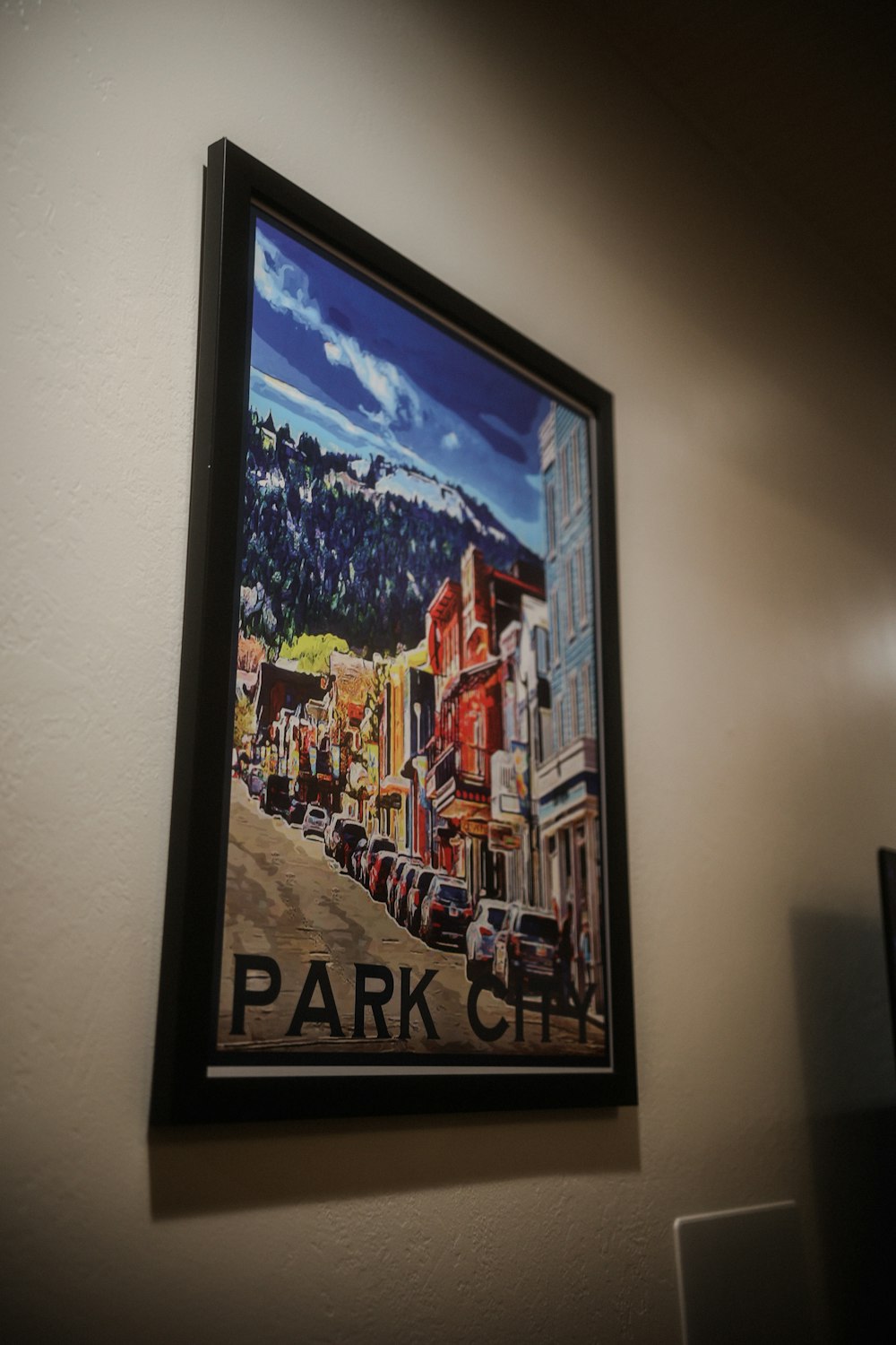 a picture hanging on a wall of a city