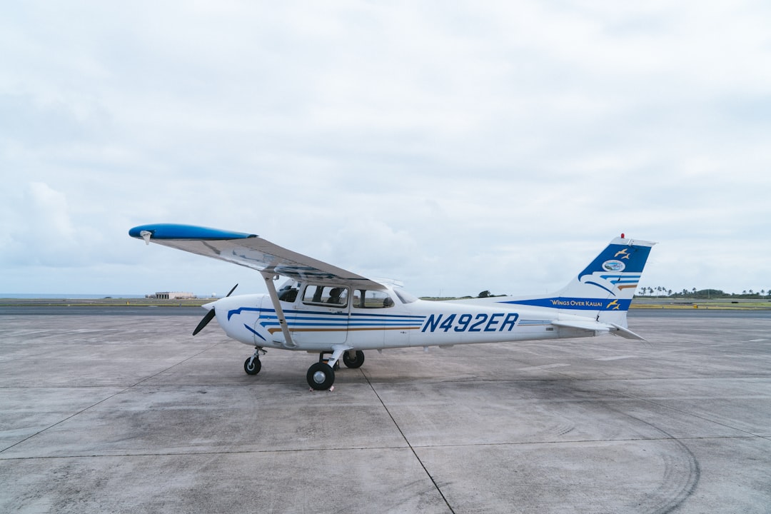 a small airplane sitting on top of an airport tarmac,