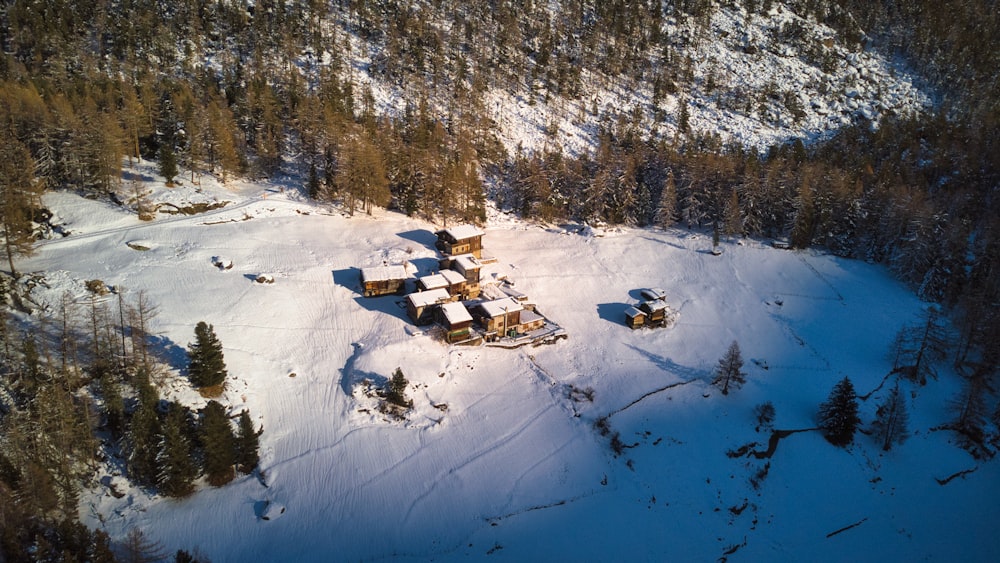 an aerial view of a house in the snow