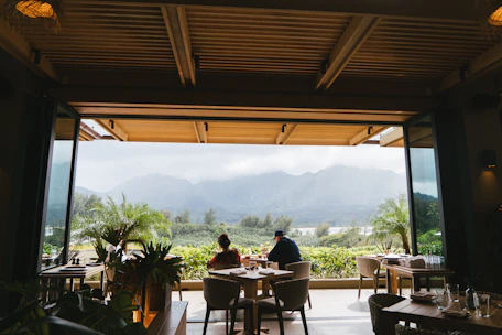 Couple enjoying a romantic dinner with panoramic views over the Petén forest.