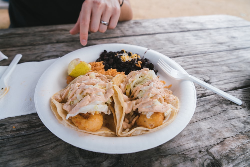 a plate of food on a wooden table