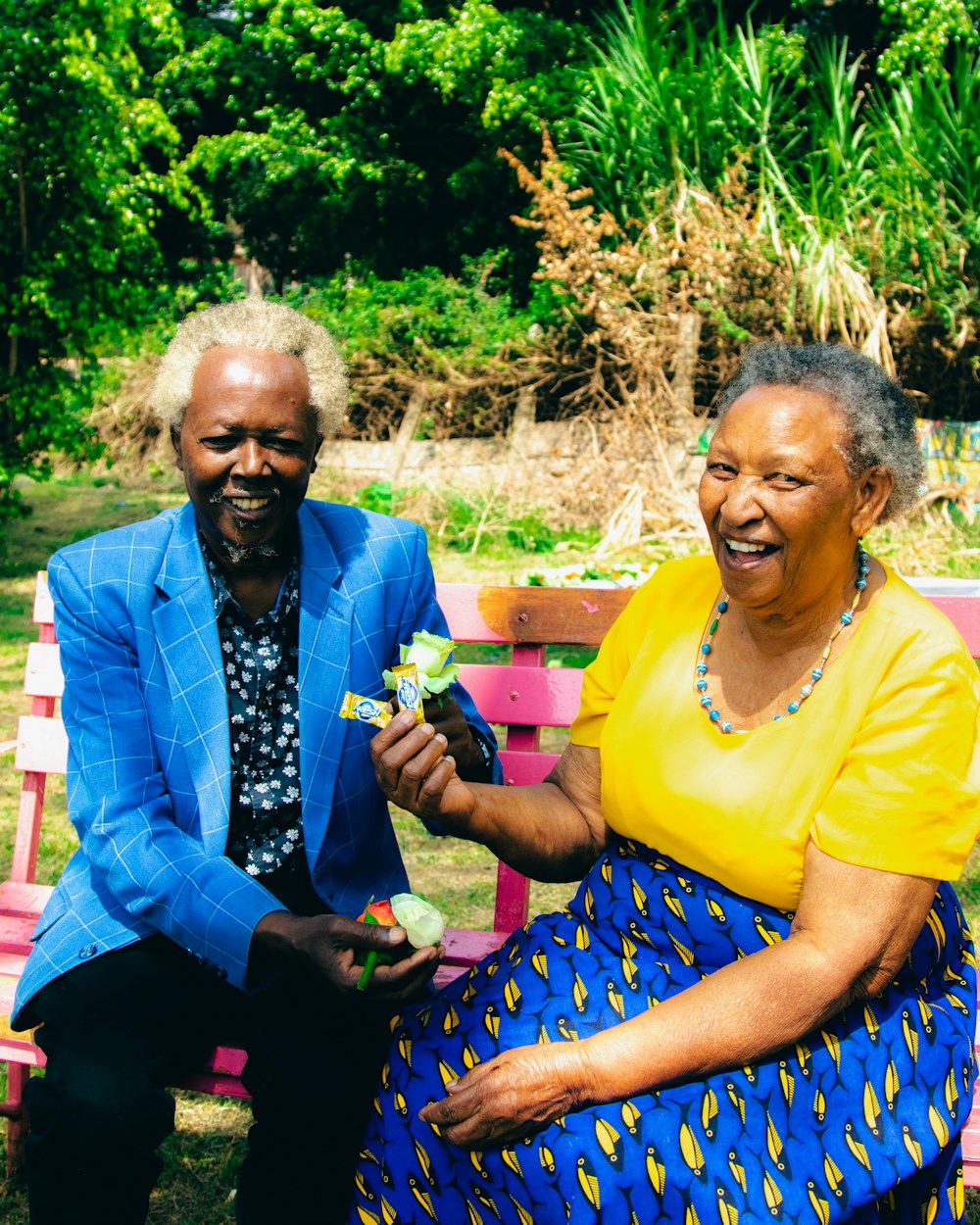 a man and a woman sitting on a bench