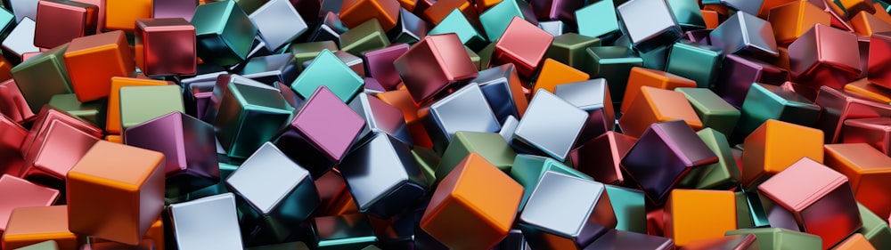 a bunch of colorful cubes that are in the air