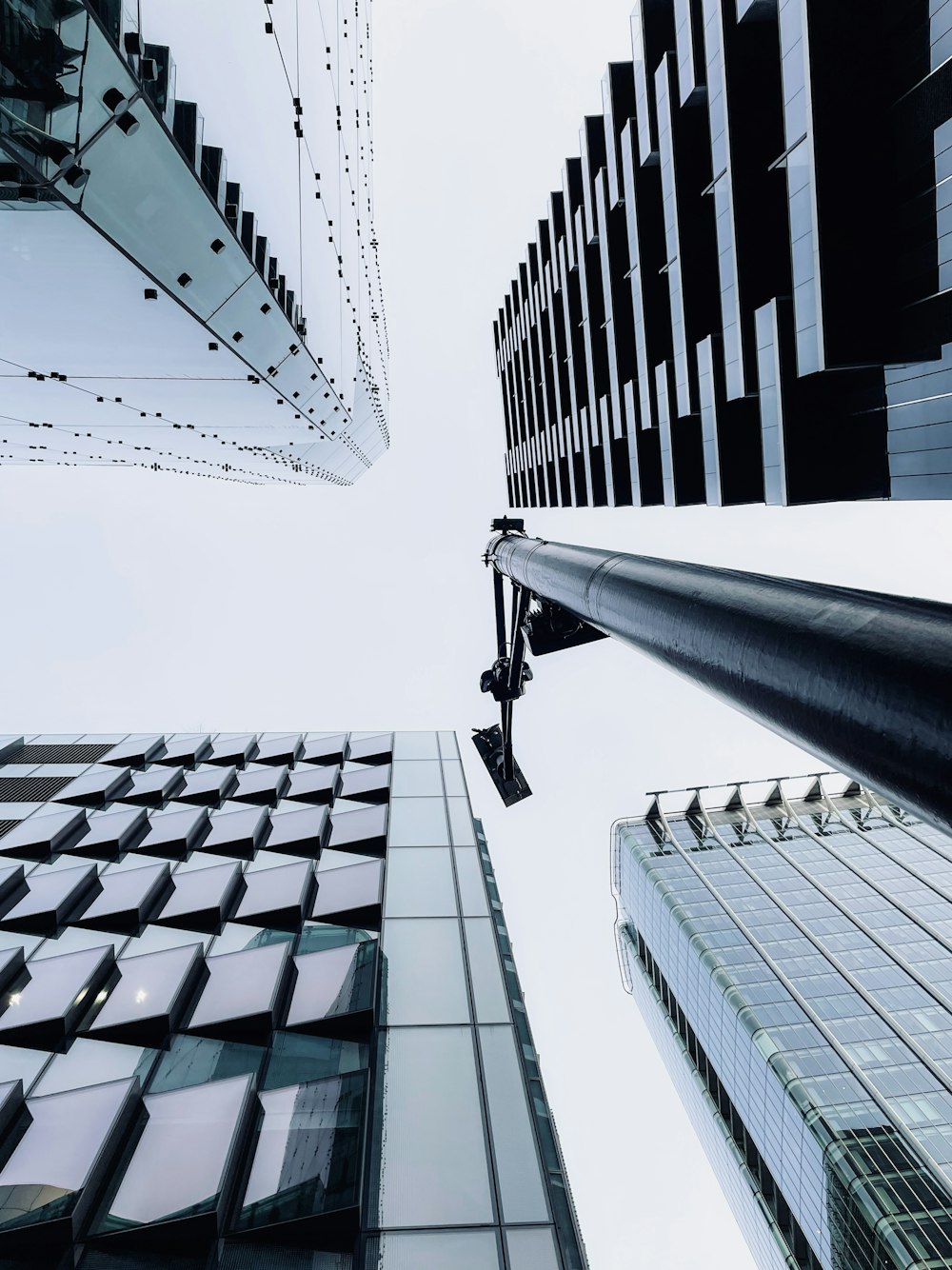 looking up at tall buildings in a city