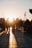 Pilgrims walking peacefully near the Kaaba during sunset.