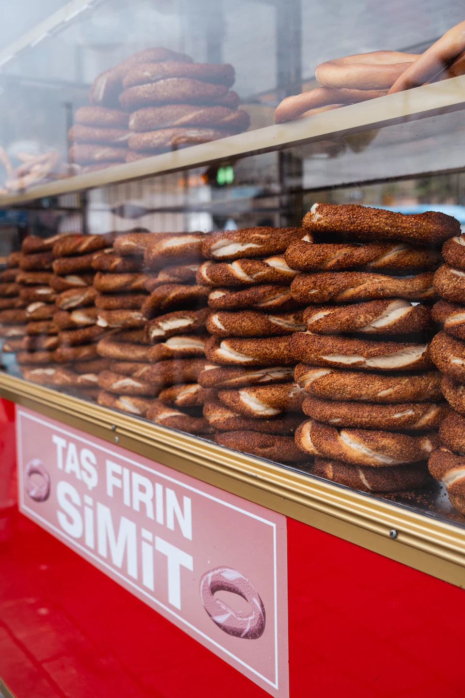 Display case filled with stacks of brown pretzels on shelves stacked atop each other