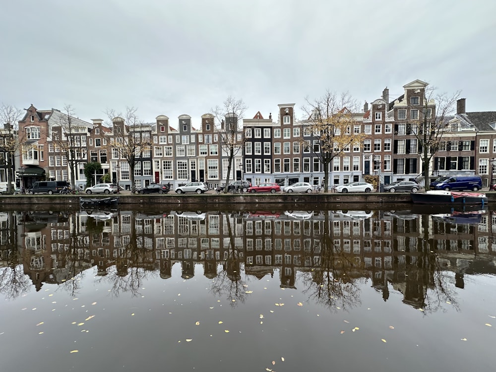 a row of houses next to a body of water