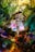 A whimsical fairy figurine sits amidst a vibrant, magical setting filled with colorful gemstones and lush greenery. Twinkling lights add a dreamlike quality to the scene, and the fairy wears a shimmering green dress and delicate wings.