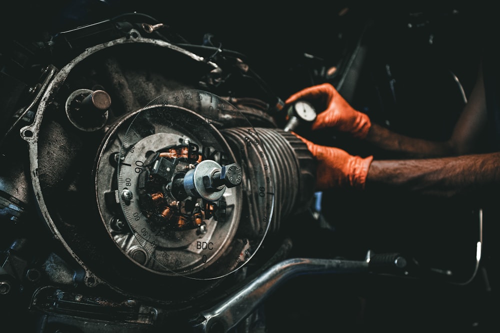 a man working on an engine in a garage