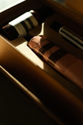 soft ambient light highlighting a set of premium wellness products on a dark surface