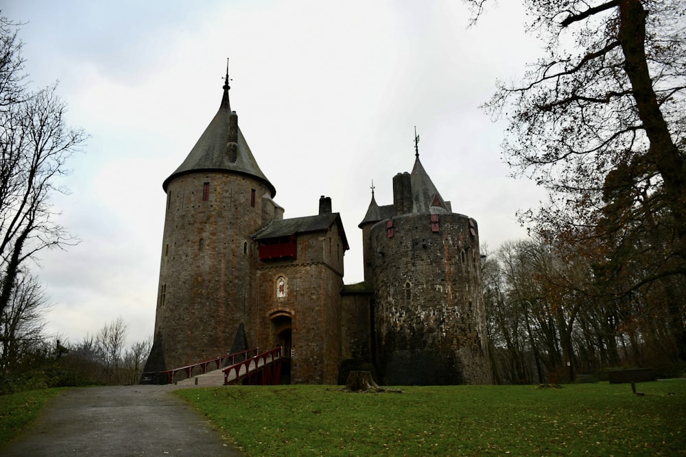 an old castle with a walkway leading to it