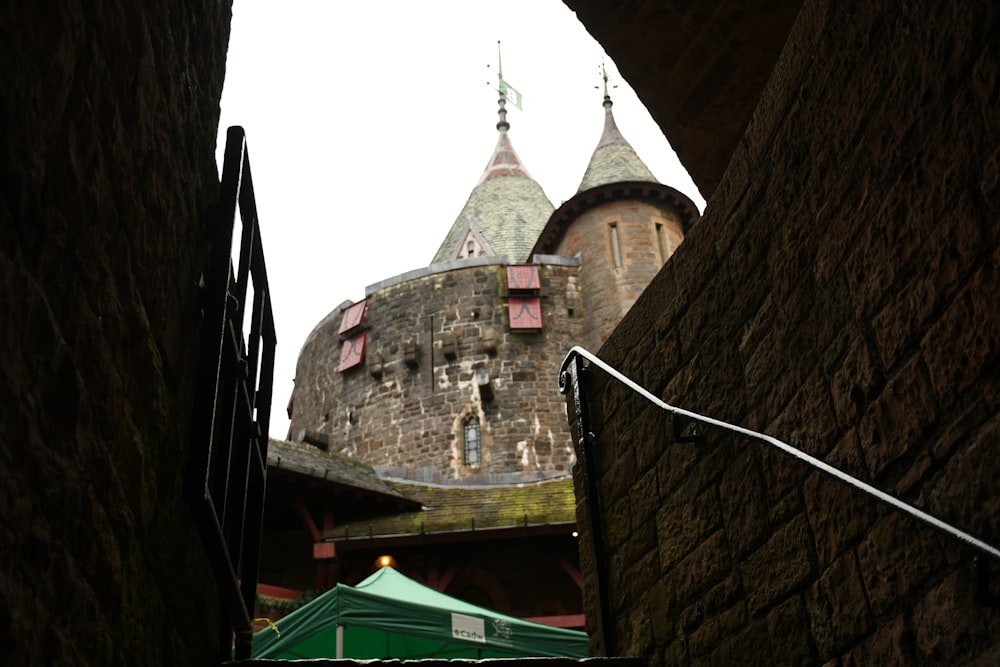 a view of a castle through an alley way